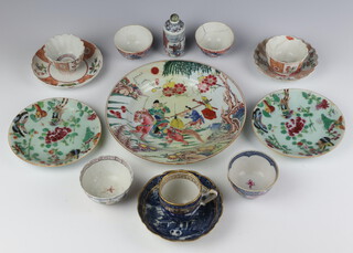 An 18th Century Chinese blue, white and gilt tea cup and saucer, 2 18th Century tea bowls, 2 19th Century tea bowls, 2 18th Century tea bowls and saucers, 2 Celadon dishes, an 18th Century plate decorated with figures (restored) and a porcelain scent bottle (all a/f)