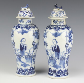 A pair of Chinese 19th Century blue and white oviform vases decorated with figures on a balcony with panels of birds and bats 26cm 
