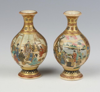 A pair of Meiji period Satsuma baluster vases decorated with figures in landscapes and pavilion interiors 9cm, both signed 