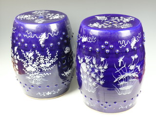 A pair of Chinese blue and white barrel garden seats decorated with birds, bats and flowers 46cm 