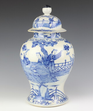 A late 19th Century Chinese blue and white oviform jar and cover decorated with figures on a pavilion terrace 44cm 