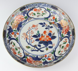 A 19th Century Imari shallow bowl decorated with flowers 32cm (stuck and restored) 