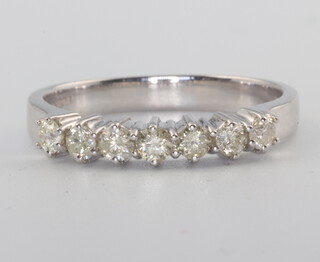 An 18ct white gold 7 stone diamond ring, approx. 0.5ct, 3.7 grams, size P, with WGI certificate 