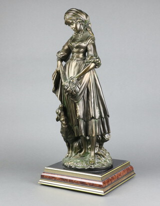A bronzed figure of a standing shepherdess with sheep, raised on a square base 62cm h x 26cm w x 26cm d 