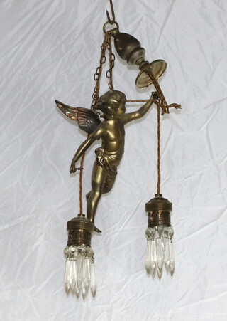 A 1930/40's gilt metal light fitting in the form of a cherub in flight 31cm h x 28cm w x 15cm d 