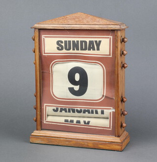 An Edwardian perpetual calendar contained in an oak case 30cm x 21cm x 8cm 