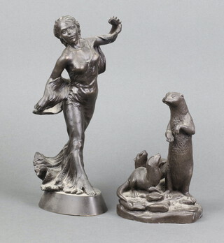 A bronzed figure of a standing lady, on an oval base 25cm h x 10cm x 7cm d and 1 other bronze figure group of an otter and pups 15cm x 10cm x 10cm 