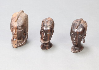 Three carved African portrait busts 23cm x 17cm x 8cm, 23cm x 11cm x 7cm and 20cm h x 7cm w x 10cm d 