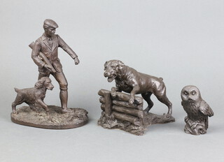 A bronzed figure of a Rottweiler 14cm x 16cm x 11cm, a bronzed figure of an owl 9cm x 3cm x 4cm, bronzed figure of a gamekeeper and dog on an oval vase 22cm x 17cm x 11cm (shot gun a/f) 