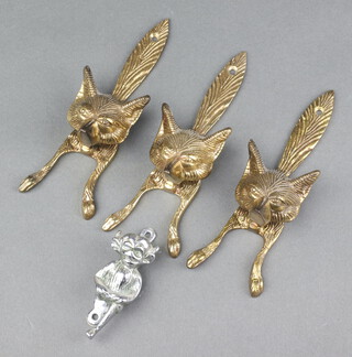 Three brass door knockers in the form of foxes masks 15cm x 5cm, together with 1 other in the form of an imp 7cm x 2cm 