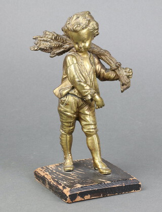 A 19th Century gilt bronze figure of a boy with sheath of corn, raised on a square wooden base 16cm 