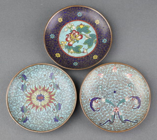 Three circular Japanese cloisonne enamelled saucers with floral decoration 10cm diam. 
