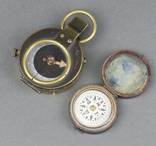 A Verner's Patent military compass no.303080 dated 1915, name scratched to the base  together with a pocket compass with silvered dial, contained in a leather case 3cm 
