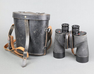 A pair of Second World War Canadian military issue binoculars with broad arrow marked C.G.B 40 MA. 7x50 21588C Rel/Canada 1944, complete with original black leather carrying case R.E.L. Canada 