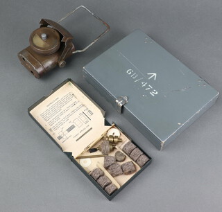 A Second World War torch with deflector to the front, the back marked Lamp Electric C.C.C and with broad arrow, a Discofelt gun cleaning set in a wooden box, a grey painted Military Issue box with hinged lid 4cm x 22cm x 15cm d 