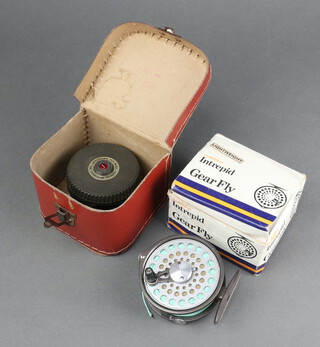 A Mitchell 710 automatic fishing reel boxed and an Intrepid Gear fly reel boxed 