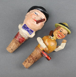 A Kink Bee character bottle stopper in the form of Winston Churchill 12cm and 1 other in the form of a drummer boy 