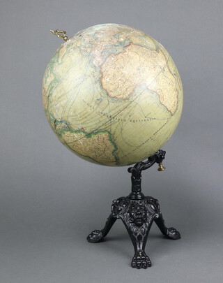 A.N. Lebegue & Cie, a 19th Century terrestrial globe raised on an iron stand with mask and paw feet, labelled Globe Terrestre A.N. Lebegue & Cie Editeurs 46 Rue De La Madeleine 46 Bruxelle, the globe is 36cm, 50cm overall  