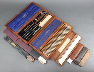 A part Stanley Victorian brass geometry set contained in a mahogany case, 12 various rulers contained in a Lawes Brothers mahogany box with hinged lid, 5 various slide rules and a 24" gauge 
