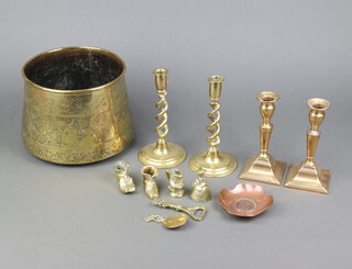 A pair of 19th Century brass candlesticks with ejectors, raised on square feet 7cm h x 8cm (1 has old solder repair), a pair of 19th Century brass spiral candlesticks 20cm x 10cm, an Eastern engraved brass jardiniere 16cm h and other minor brassware 