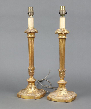A pair of gilt painted composition fluted table lamps on spreading feet 42cm h x 16cm 