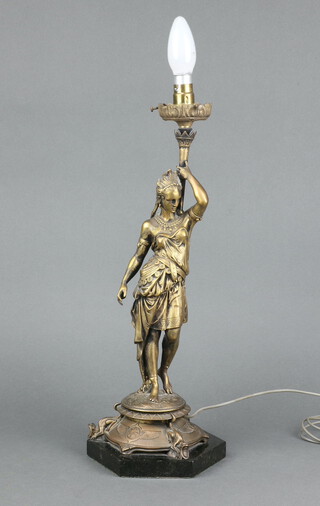 An Art Deco style bronze table lamp with glass flame shade, raised on a hexagonal black marble base with a figure of a standing lady 56cm h x 17cm 