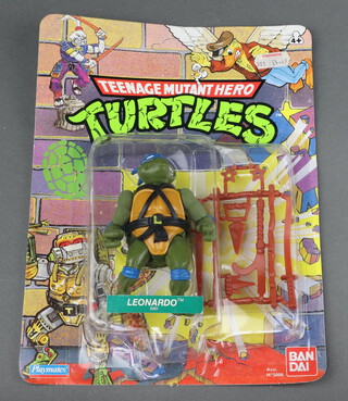Teenage Mutant Hero Turtles, an original Playmates Bandai carded and unpunched figure of Leonardo (5001) with Woolworths sticker 