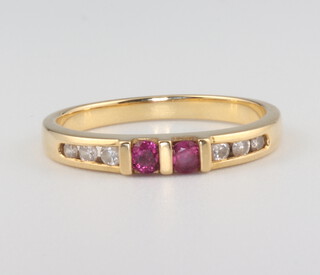 A yellow metal 18k ruby and diamond ring size M, 2.7 grams
