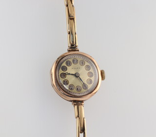 A lady's 9ct yellow gold vintage Rolex wristwatch on a plated bracelet 