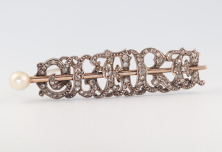 An Edwardian yellow metal diamond and pearl set bar brooch, 9 grams, 40mm 