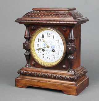 A Victorian 8 day mantel clock with 12cm blue enamelled dial, Roman numerals, striking on bell, the back plate marked 4380, contained in a carved walnut case 27cm h x 23cm w x 12cm d, complete with pendulum, no key  