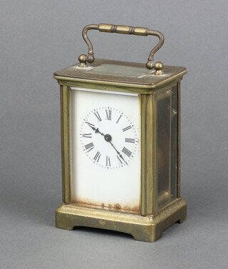 A 19th Century French 8 day carriage timepiece with 5cm dial, contained in a gilt metal case 10cm x 8cm x 6cm  