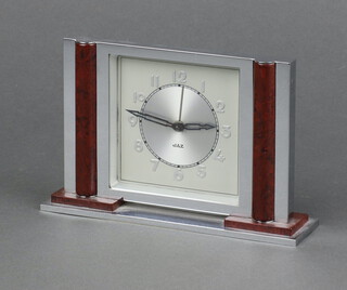 Jaz, an Art Deco alarm clock, the 8cm silvered dial with Roman numerals marked Jaz, contained in a chrome and Bakelite case 11cm x 16cm x 4cm 

