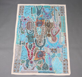 A turquoise white ground hand stitched wool hanging with sequins 153cm x 103cm 