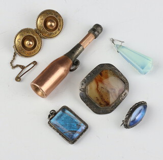 A Victorian yellow metal Etruscan style brooch, a novelty propelling pencil in the form of a champagne bottle and minor jewellery 