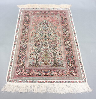 A white, blue and brown Persian silk rug with mihrab to the centre within a multi row border 153cm x 95cm 