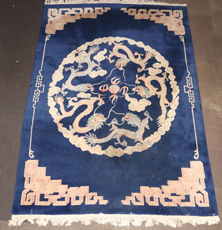 A blue and white ground Chinese carpet decorated dragons 350cm x 243cm  