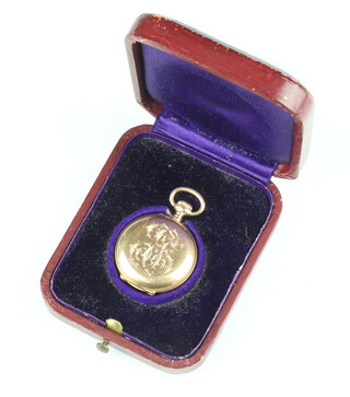 A lady's Edwardian yellow metal 18k fob watch with engraved monogram, contained in a 40mm case with original fitted box, gross weight 24 grams 