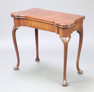 A 19th Century Georgian style shaped mahogany card table, the baise interior with counter wells and candle stands the corner, raised on cabriole supports 73cm h x 87cm w x 43cm d 