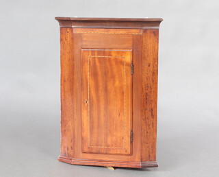 A Georgian inlaid mahogany corner cabinet with moulded cornice, fitted shelves enclosed by panelled door 68cm h x 47cm w x 44cm d 