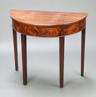 A 19th Century mahogany demi-lune tea table raised on square supports 73cm h x 84cm w x 41cm d 
