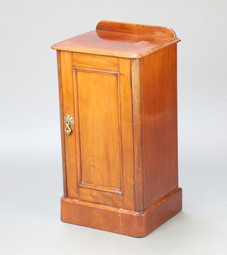 A Victorian mahogany pot cupboard with raised back enclosed by a panelled door 74cm h x 39cm w x 31cm d 