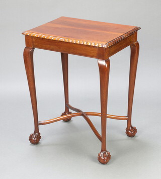 An Edwardian rectangular Chippendale style mahogany occasional table raised on cabriole, ball and claw supports with X framed stretcher 76cm h x 59cm w x 45cm d 