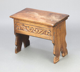 An Ipswich style carved oak stool/coffer with hinged lid raised on standard end supports 45cm h x 56cm w x 32cm d 