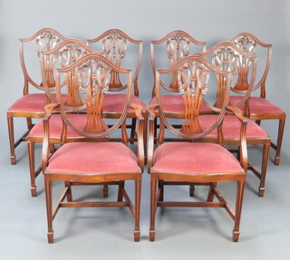 A set of 8 20th Century Hepplewhite style mahogany camel back dining chairs with pierced vase shaped slat backs and seats of serpentine outline, having Prince of Wales decoration, raised on square tapered supports with H framed stretchers, comprising 2 carvers 98cm h x 52cm w x 45cm d and 6 standard chairs 97cm h x 52cm w x 47cm d  