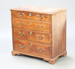An 18th/19th Century oak chest of 4 long drawers with steel locks and brass swan neck drop handles, raised on bracket feet 76cm h x 78cm w x 43cm d 