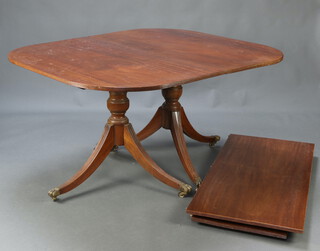 A Georgian style mahogany twin pillar extending dining table with 2 extra leaves 75cm h x 118cm w x 137cm l x 238cm l when extended