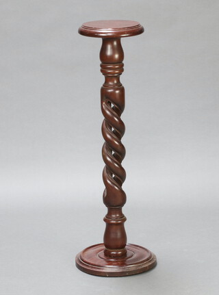 A Victorian style circular pedestal raised on a pierced spiral turned column, circular base 91cm h x 23cm diam. 
