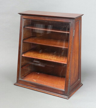 An Edwardian mahogany wedge shaped confectionary or cigar cabinet fitted shelves enclosed by bevelled plate panelled door 56cm h x 49cm w x 26cm 