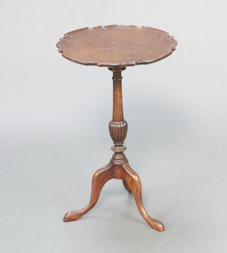 A 1930's Chippendale style circular mahogany wine table with pie crust edge, raised on pillar and tripod base 62cm h x 40cm diam. 